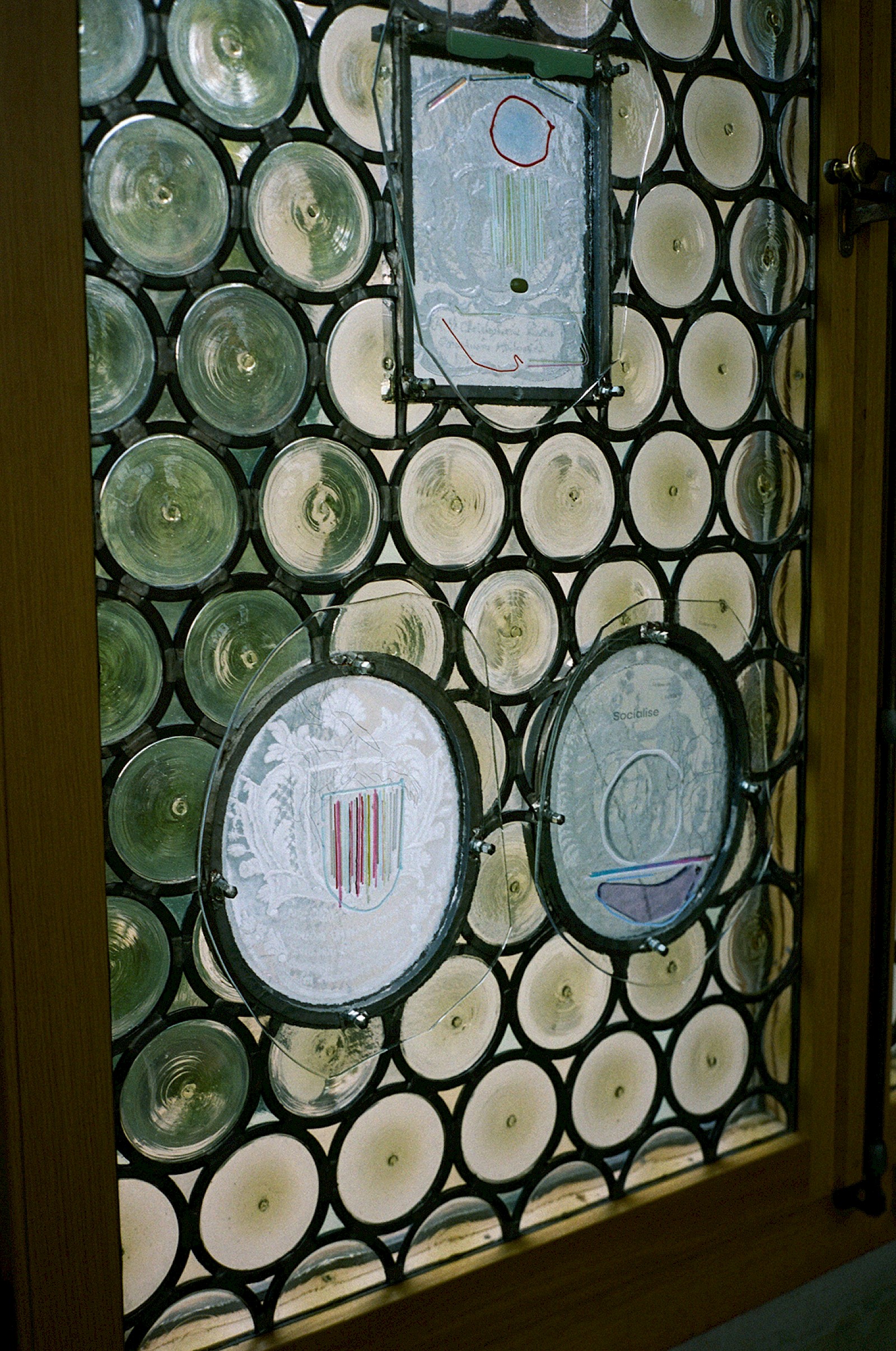 Image - Glas in front of stained-glass windows